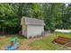 Shed and backyard area, perfect for storage with play area, surrounded by lots of trees at 6691 N Baltimore Rd, Monrovia, IN 46157
