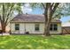 Spacious backyard with mature trees, manicured lawn, and patio area near a privacy fence at 6760 Navigate Way, Indianapolis, IN 46250