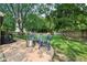 Charming backyard with a modern fire pit, Adirondack chairs, and ample space for entertaining at 6760 Navigate Way, Indianapolis, IN 46250