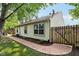 A charming single-story home is fenced in and features a well-maintained walkway and lovely landscaping at 6760 Navigate Way, Indianapolis, IN 46250