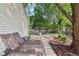 Relaxing backyard with lounge chairs, inviting seating around a fire pit, and a charming landscaped area at 6760 Navigate Way, Indianapolis, IN 46250