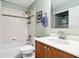 Bathroom featuring a shower/tub combination, decorative tile, and a wood vanity at 6760 Navigate Way, Indianapolis, IN 46250