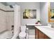 Bathroom features a shower and tub combination with decorative artwork and a modern vanity at 6760 Navigate Way, Indianapolis, IN 46250