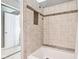 Well-lit bathroom features a bathtub with tiled walls, mosaic accents, and a recessed niche at 6760 Navigate Way, Indianapolis, IN 46250