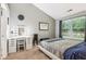 Comfortable bedroom offering a vanity, closet, and soft natural light at 6760 Navigate Way, Indianapolis, IN 46250