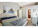 Comfortable bedroom with lots of space, natural light, and ensuite bath access at 6760 Navigate Way, Indianapolis, IN 46250