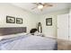 Comfortable bedroom with ceiling fan, neutral colors, and lots of natural light at 6760 Navigate Way, Indianapolis, IN 46250