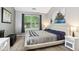 This bedroom features a large window for soft natural light at 6760 Navigate Way, Indianapolis, IN 46250