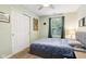 This bedroom features a ceiling fan, plush bed, and closet with sliding doors at 6760 Navigate Way, Indianapolis, IN 46250