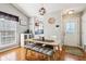 Charming dining area illuminated by modern light fixture and convenient access to kitchen and main door at 6760 Navigate Way, Indianapolis, IN 46250