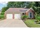 Charming single-story brick home featuring a two-car garage and well-maintained landscaping at 6760 Navigate Way, Indianapolis, IN 46250