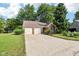 Charming single-story brick home featuring a two-car garage and well-maintained landscaping at 6760 Navigate Way, Indianapolis, IN 46250
