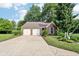Charming single-story brick home featuring a two-car garage and well-maintained landscaping at 6760 Navigate Way, Indianapolis, IN 46250