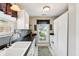 Bright kitchen featuring sleek countertops, modern appliances, and a window overlooking a serene backyard at 6760 Navigate Way, Indianapolis, IN 46250