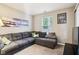 Inviting living room showcasing a sectional sofa, soft carpet, and plenty of natural light at 6760 Navigate Way, Indianapolis, IN 46250