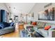 Spacious living room with hardwood floors, comfortable seating, and bright, neutral decor at 6760 Navigate Way, Indianapolis, IN 46250