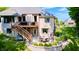 Relaxing backyard with a patio, outdoor dining, upper deck with hot tub, and green lawn at 6940 Mockernut Ct, Plainfield, IN 46168
