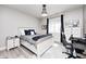 Stylized bedroom featuring light walls, a bed, and a workspace area at 6940 Mockernut Ct, Plainfield, IN 46168