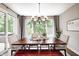 Elegant dining room featuring a wooden table, comfortable seating, and ample natural light at 6940 Mockernut Ct, Plainfield, IN 46168