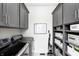 Well-organized laundry room with ample cabinet and shelf storage at 6940 Mockernut Ct, Plainfield, IN 46168