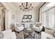 Sitting room with neutral tones, accent furniture, and a large window at 6940 Mockernut Ct, Plainfield, IN 46168