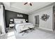 The main bedroom features a dark accent wall, large windows, and access to the main bath and closet at 6940 Mockernut Ct, Plainfield, IN 46168
