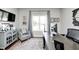 Bright office with a large desk, comfortable chair, and stylish rug at 6940 Mockernut Ct, Plainfield, IN 46168