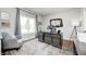 This well-lit office features a large desk and a window overlooking the property's well manicured lawn at 6940 Mockernut Ct, Plainfield, IN 46168