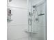 This walk-in shower features white subway tile, a built in bench, and shelving for toiletries at 6940 Mockernut Ct, Plainfield, IN 46168