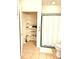 Bright bathroom featuring a tiled floor, toilet, shower with a white curtain and open closet with shelves at 6956 Park Square Dr # D, Avon, IN 46123