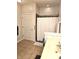 Bathroom with a shower and white curtain, and a yellow-toned vanity at 6956 Park Square Dr # D, Avon, IN 46123