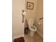 Bathroom featuring a toilet and grab bars, along with tile flooring at 6956 Park Square Dr # D, Avon, IN 46123