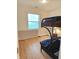 Cozy bedroom features a bunk bed, window with blinds, and wood-look flooring at 6956 Park Square Dr # D, Avon, IN 46123
