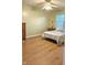 Bedroom with a bed, dresser, ceiling fan and a window to let in natural light at 6956 Park Square Dr # D, Avon, IN 46123