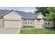 Charming brick home with well-manicured lawn and an attached garage, perfect for suburban living at 6956 Park Square Dr # D, Avon, IN 46123
