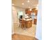 Kitchen features a breakfast bar, white appliances and tiled flooring at 6956 Park Square Dr # D, Avon, IN 46123