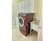 A laundry room is equipped with a sink and modern washer and dryer sets, offering convenience at 6956 Park Square Dr # D, Avon, IN 46123