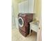 A laundry room is equipped with a sink and modern washer and dryer sets, offering convenience at 6956 Park Square Dr # D, Avon, IN 46123