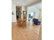 Open living area with hardwood floors features a round table, grandfather clock and comfortable seating at 6956 Park Square Dr # D, Avon, IN 46123