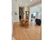 Open living area with hardwood floors features a round table, grandfather clock and comfortable seating at 6956 Park Square Dr # D, Avon, IN 46123