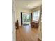 Bright office space features a desk, sliding glass door, and wood-look flooring at 6956 Park Square Dr # D, Avon, IN 46123