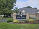 Community entrance featuring beautiful landscaping, a well-manicured lawn, and welcoming signage at 6956 Park Square Dr # D, Avon, IN 46123