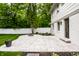 Backyard showcasing a patio with a fire pit and well-manicured lawn at 7105 Sylvan Ridge Rd, Indianapolis, IN 46240