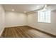 Finished basement with stylish wood flooring and modern recessed lighting at 7105 Sylvan Ridge Rd, Indianapolis, IN 46240