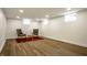 Finished basement with stylish wood flooring and modern recessed lighting at 7105 Sylvan Ridge Rd, Indianapolis, IN 46240
