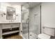 Bathroom featuring vanity, walk-in shower with glass door and toilet at 7105 Sylvan Ridge Rd, Indianapolis, IN 46240