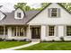 Close-up of the entrance with a beautiful walkway, white brick, siding, and meticulous landscaping at 7105 Sylvan Ridge Rd, Indianapolis, IN 46240