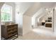Hallway with white carpet, natural light and a view to the bedroom with a bed and nightstand at 7105 Sylvan Ridge Rd, Indianapolis, IN 46240