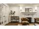 Elegant living room features a fireplace, hardwood floors, and refined decor for a warm and inviting atmosphere at 7105 Sylvan Ridge Rd, Indianapolis, IN 46240