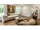 Bright living room featuring a comfortable sofa, natural lighting, and stylish decor for a relaxing atmosphere at 7105 Sylvan Ridge Rd, Indianapolis, IN 46240